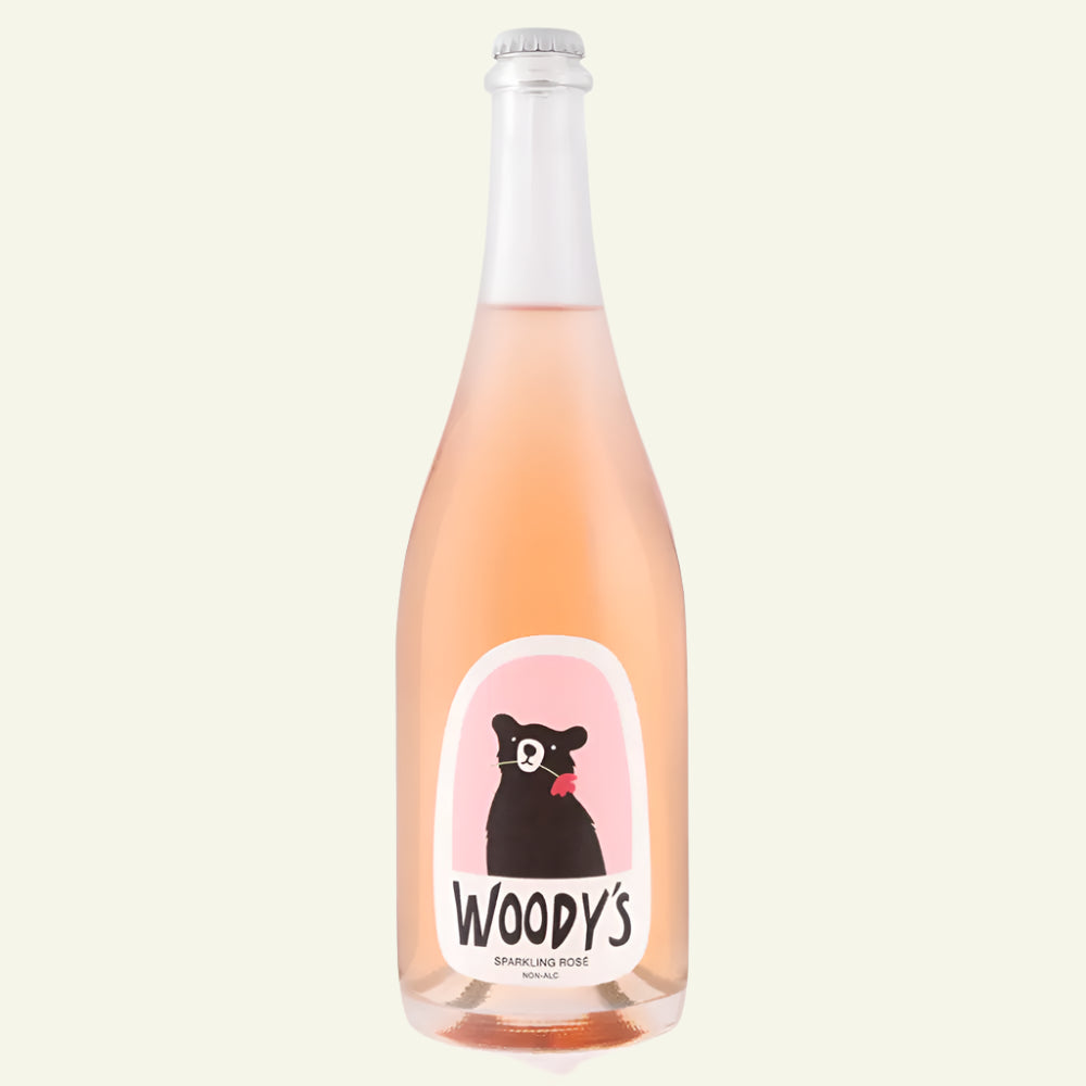 Bottle of Woody's sparkling rose wine with a black cat illustration on a white background