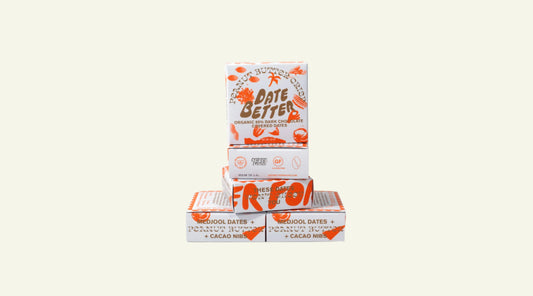 Stack of 'Date Better' boxes on a white background