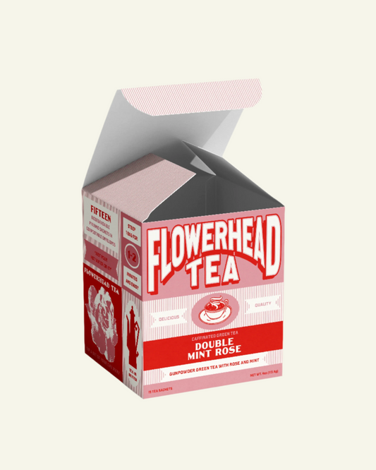 A box of Flowerhead Tea Double Mint Rose with tea bags visible inside the open box.