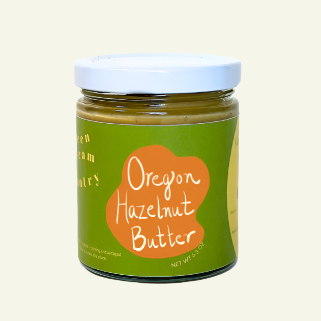Jar of Oregon Hazelnut Butter with a green label on a white background