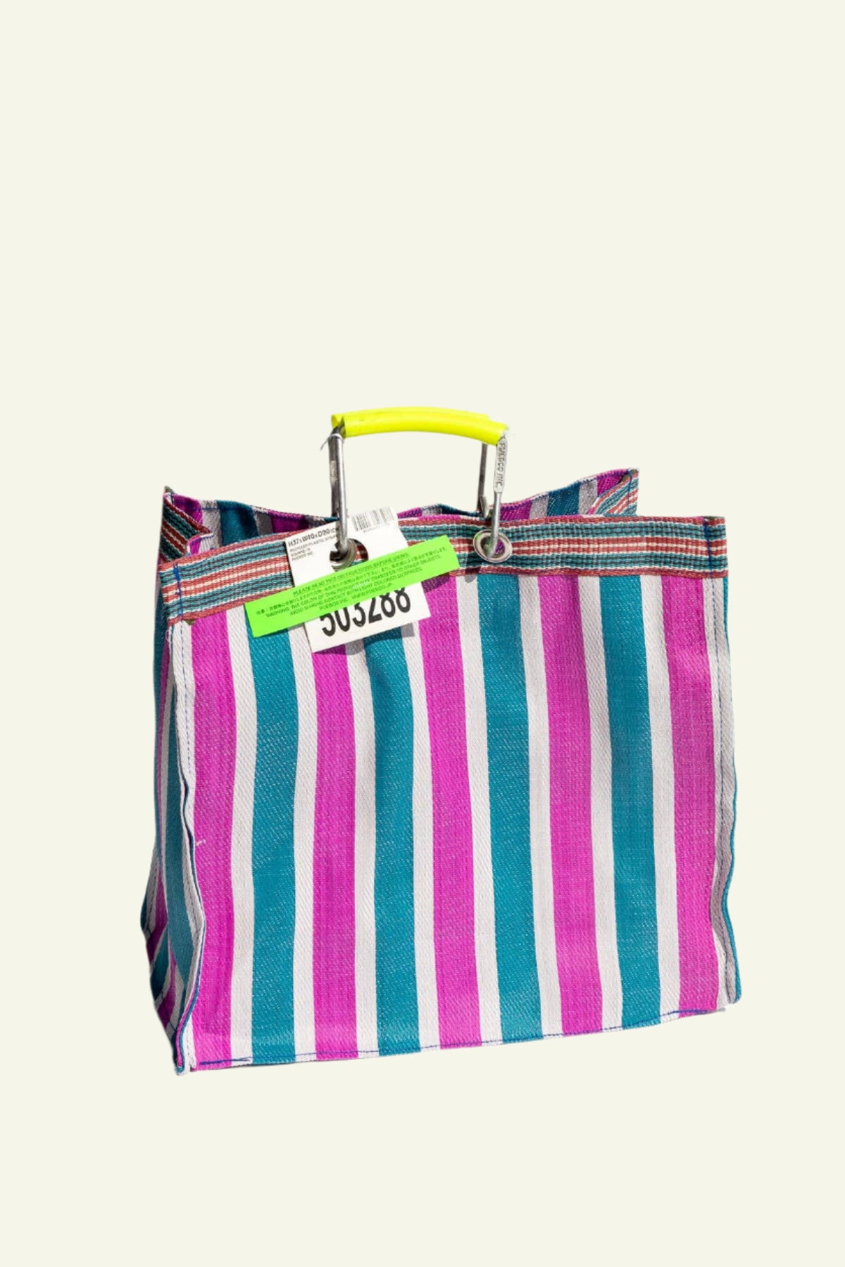 A hand-woven striped tote bag in green and pink with strong aluminum handles.