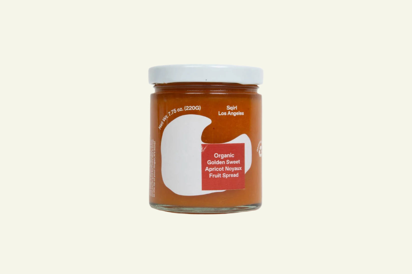 Jar of organic fruit spread on a white background