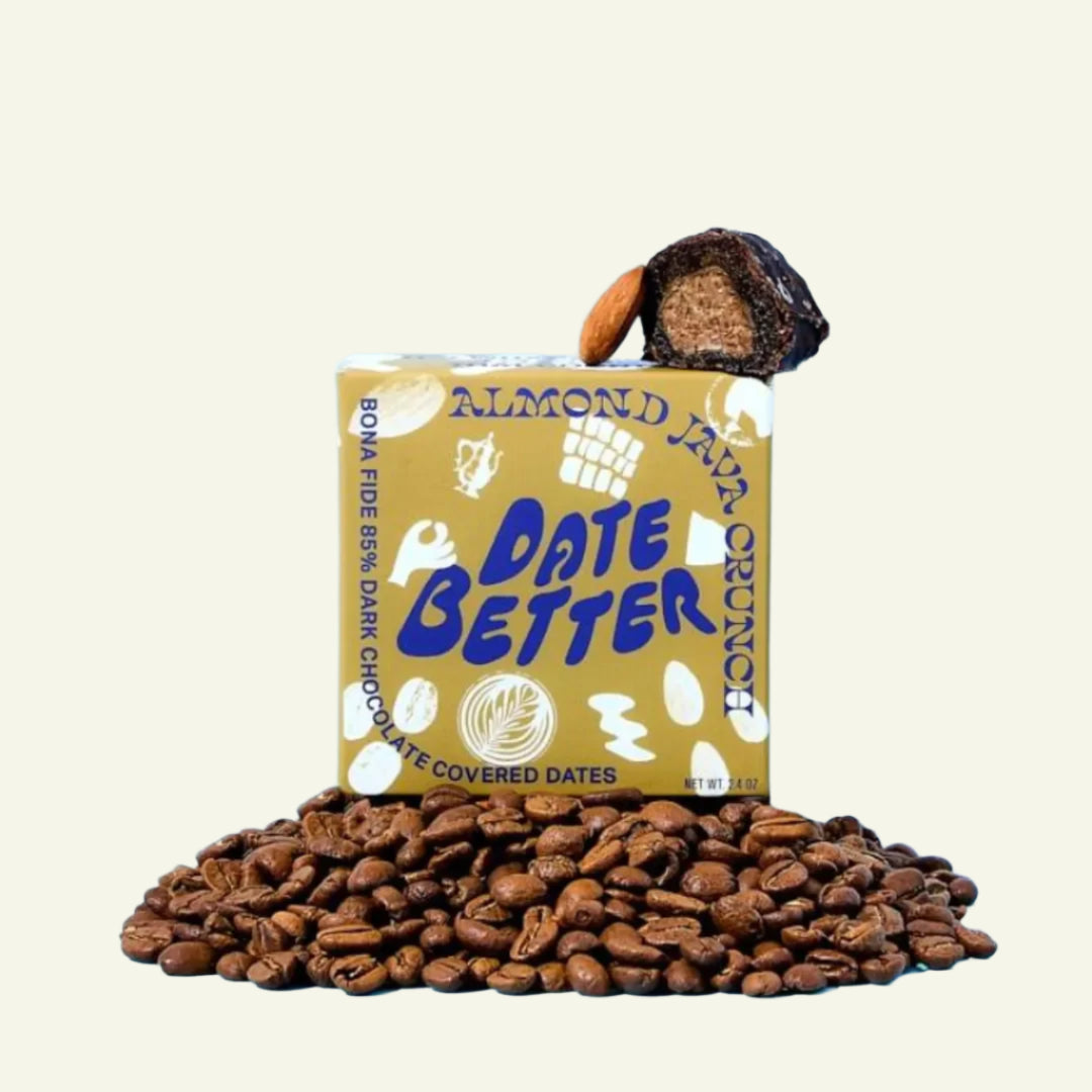 Box of 'Date Better' chocolate-covered dates with a pile of coffee beans on a blue background