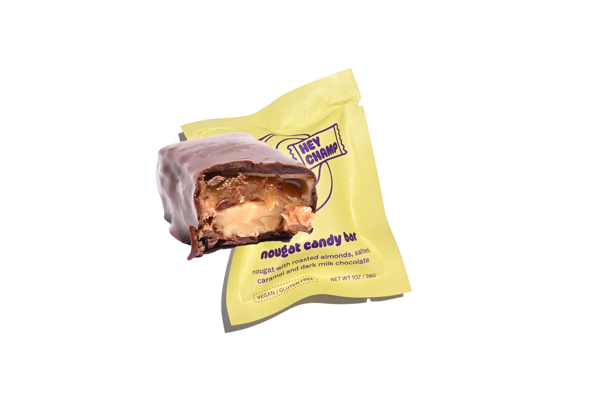 A packaged nougat candy bar with visible roasted almonds and caramel, wrapped in a yellow and purple wrapper.