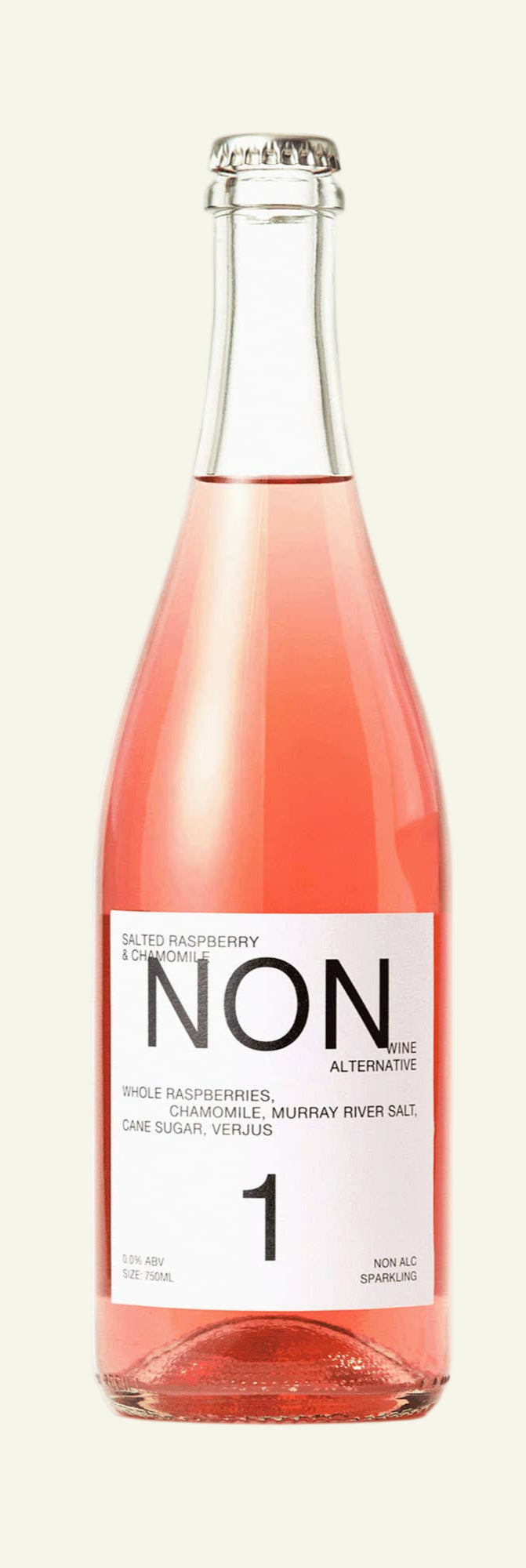 Bottle and glass of pink non-alcoholic wine with 'NON' label on a white background