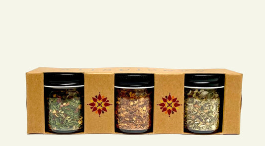 Three spice jars in a cardboard box labeled 'Pizza Night' on a white background