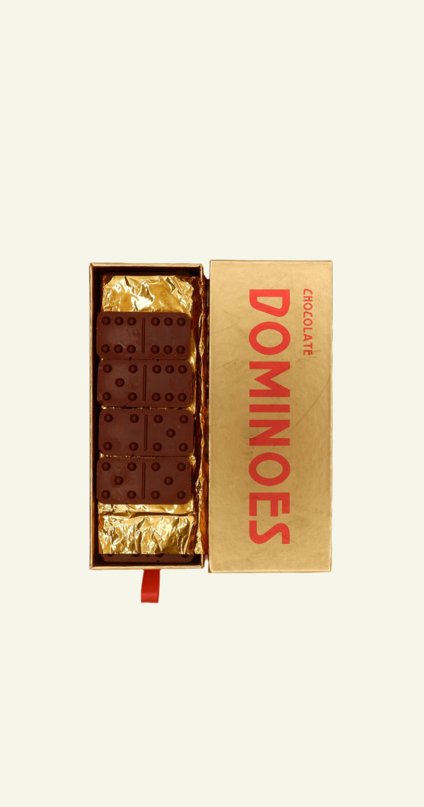 Chocolate bars in a 'Chocolate DOMINOES' box on a beige background