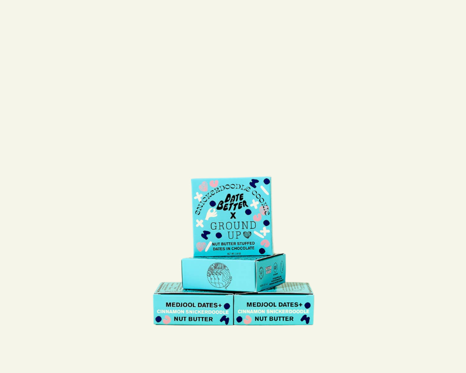Three boxes of 'The Good Bar' on a beige background