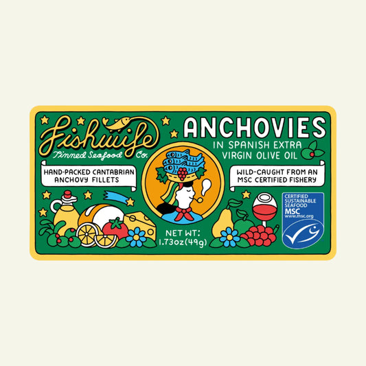 Label of a tin can of Fishwife Cantabrian Anchovies in Spanish extra virgin olive oil, showcasing the anchovies and the brand's logo with various colorful illustrations.