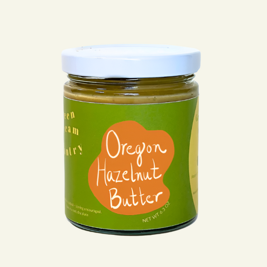 Jar of Oregon Hazelnut Butter with a green label on a white background