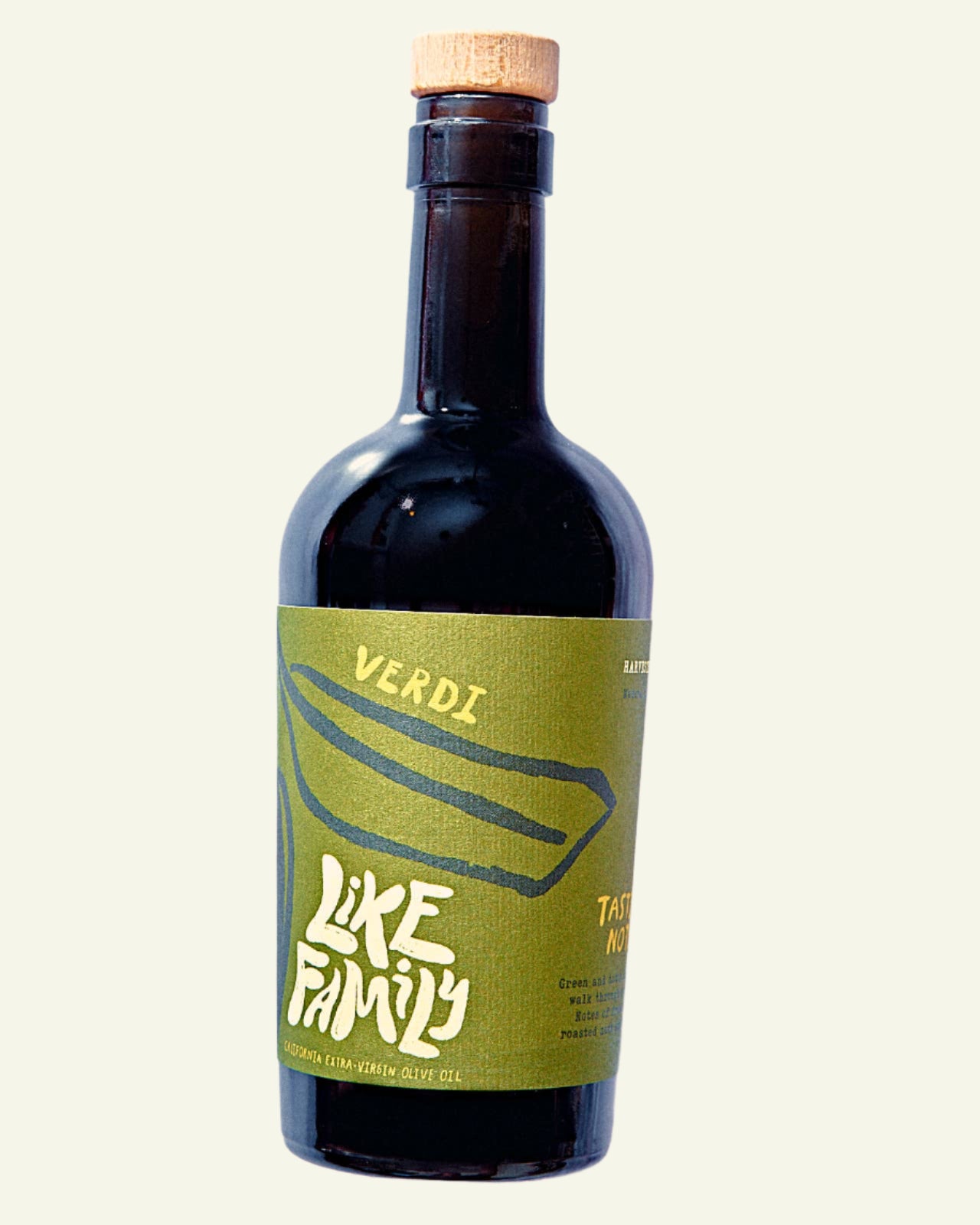 A bottle of Verdi Extra Virgin Olive Oil with a green label, cork seal, and dark liquid visible.