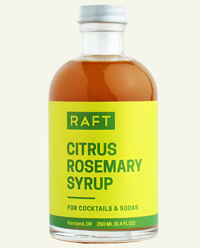 Bottle of RAFT Citrus Rosemary Syrup on a white background
