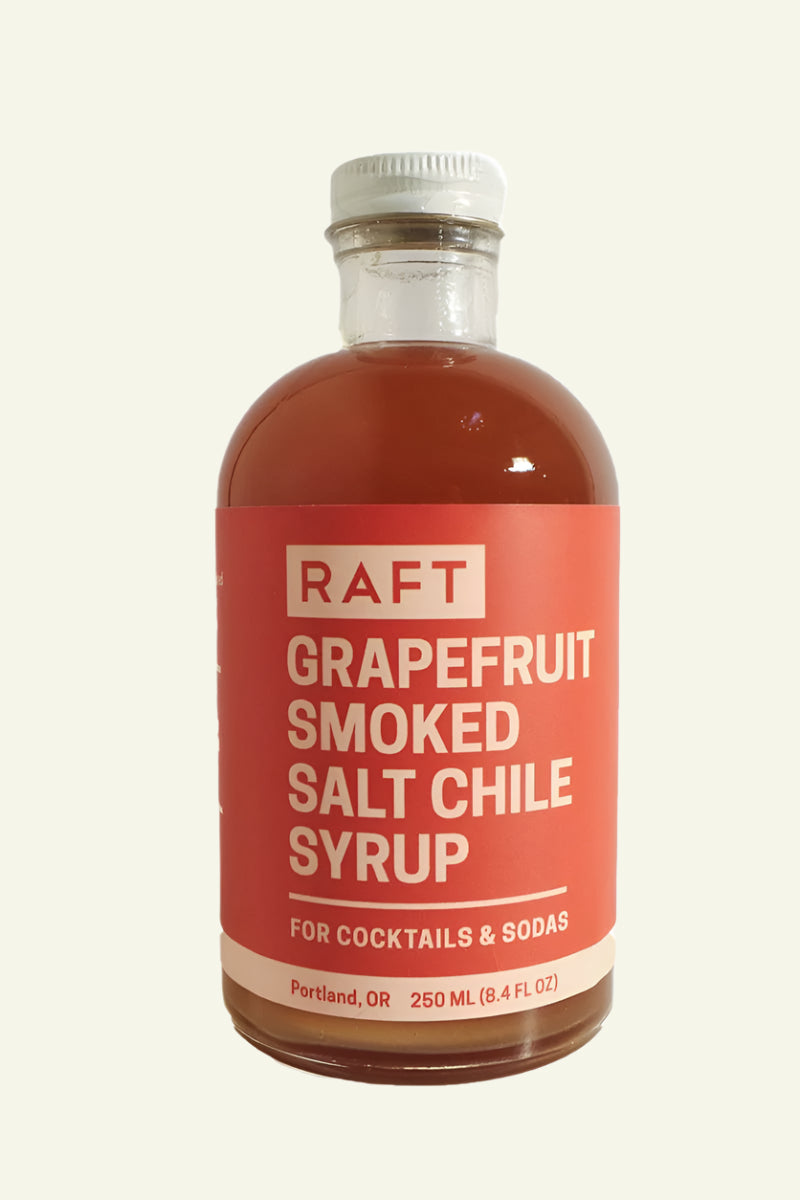 Bottle of RAFT Grapefruit Smoked Salt Chile Syrup on a white background