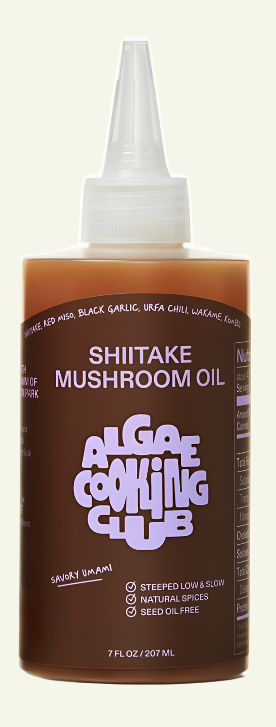 Bottle of Shiitake Mushroom Oil with labels, set against a white background with a shadow on the left bottom corner. One bottle is upright and the other is lying down, indicating a possible break or damage during delivery.