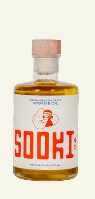 Bottle of Sooki sesame oil on a white background