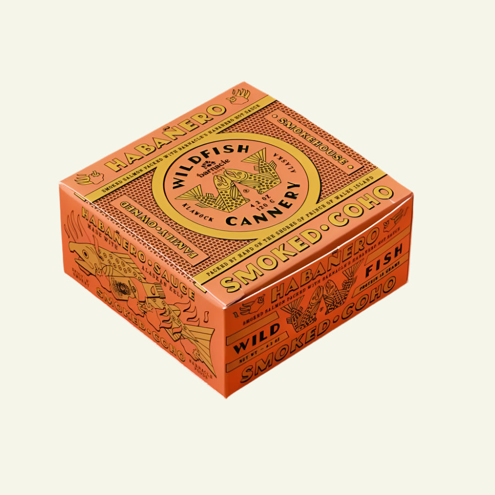Box of Wildfish Cannery smoked fish on an orange background
