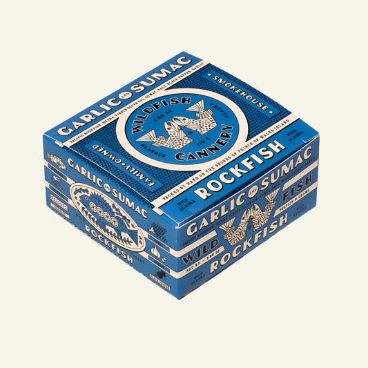 Blue packaging box with 'Wildfish Cannery' branding on a white background