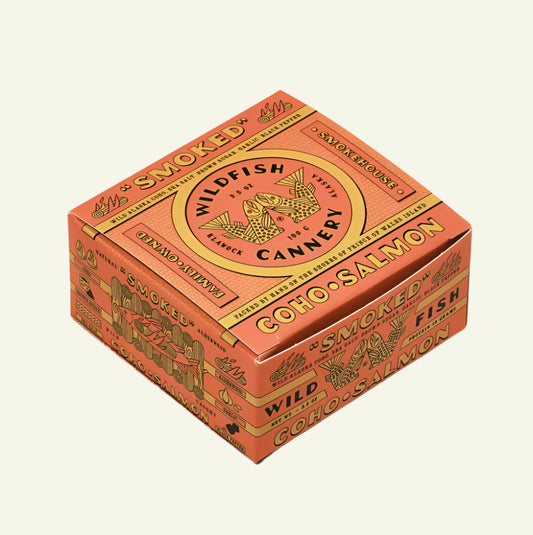 Box of Wildfish Cannery smoked coho salmon on a beige background