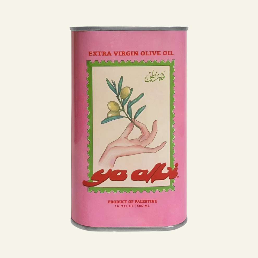 A can of Extra Virgin Olive Oil with a label depicting a hand holding an olive branch, and the brand name 'ya albi' in pink lettering.