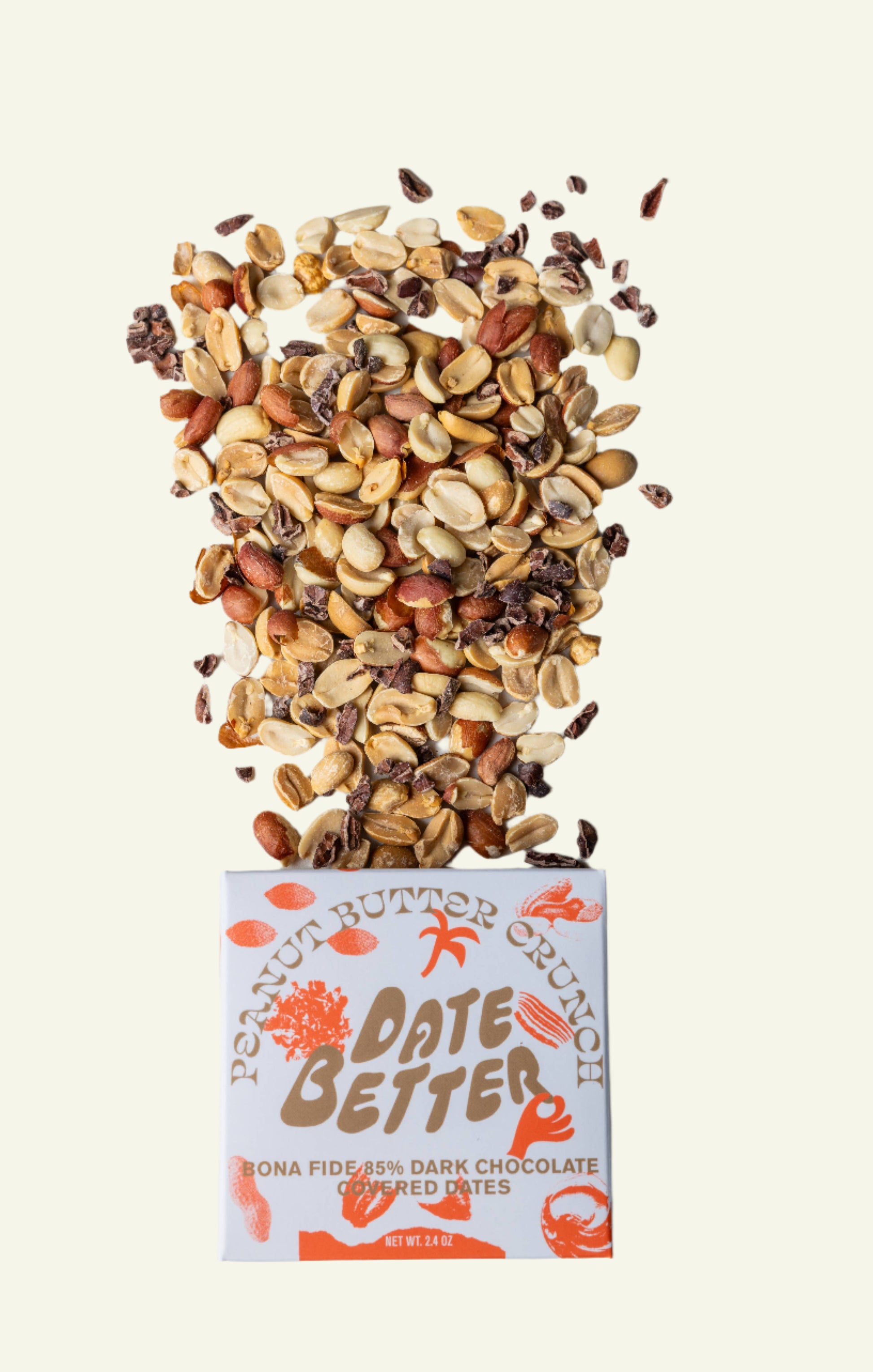 Box of Date Better chocolate with a scattering of nuts and seeds on a light background