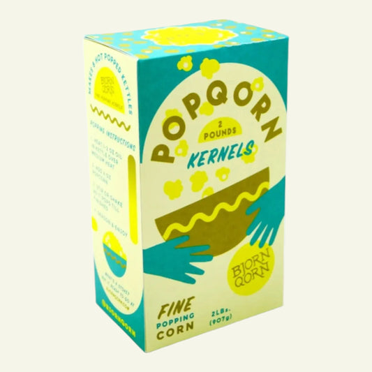 Box of Popqorn kernels with teal and yellow design on a white background