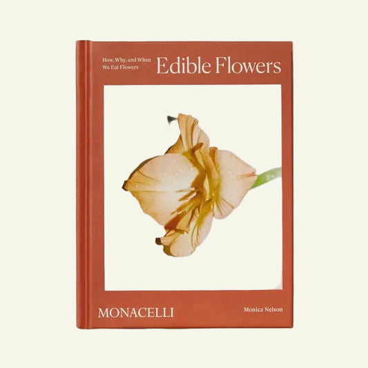 Book titled 'Edible Flowers' by Monacelli on a white background