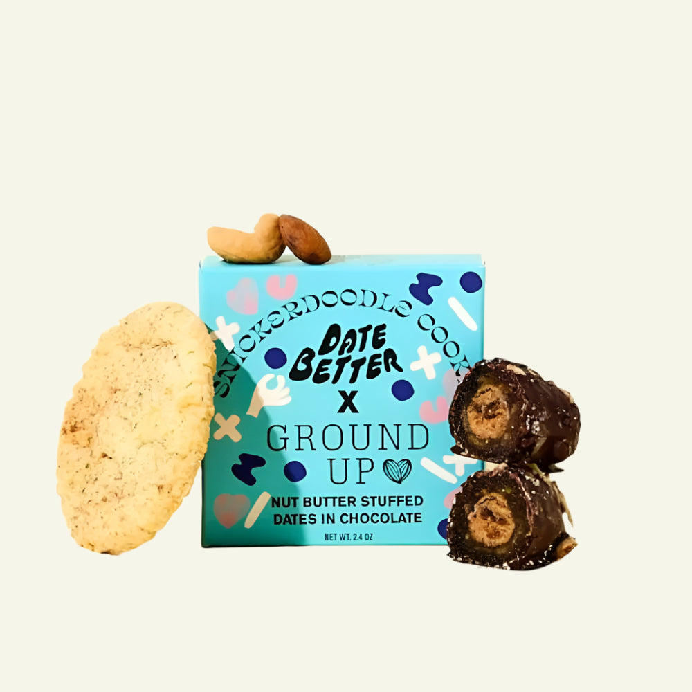 Snickerdoodle cookie, box of cookies, and chocolate-dipped dates on a light beige background