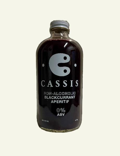 Bottle of non-alcoholic blackcurrant aperitif on a white background